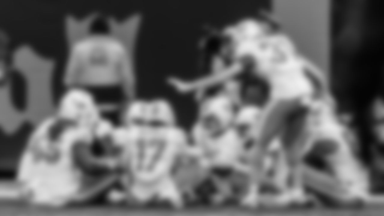 Miami Dolphins offensive lineman Aaron Brewer (55), wide receiver Jaylen Waddle (17) and running back Ollie Gordon II (31) celebrate during an NFL football game against the New York Jets on Sunday, Dec. 7, 2025 in East Rutherford, NJ. (Raul Maristany/Miami Dolphins via AP)