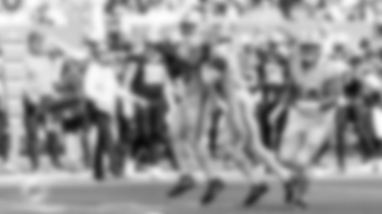 Miami Dolphins linebacker Tyrel Dodson (25) and safety Ifeatu Melifonwu (9) celebrate during an NFL football game against the New Orleans Saints on Sunday, Nov. 30, 2025 in Miami Gardens, FL. (Kelly Gavin/Miami Dolphins via AP)