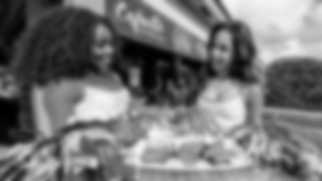 Dolphins cheerleaders try Islas Canarias croquetas.