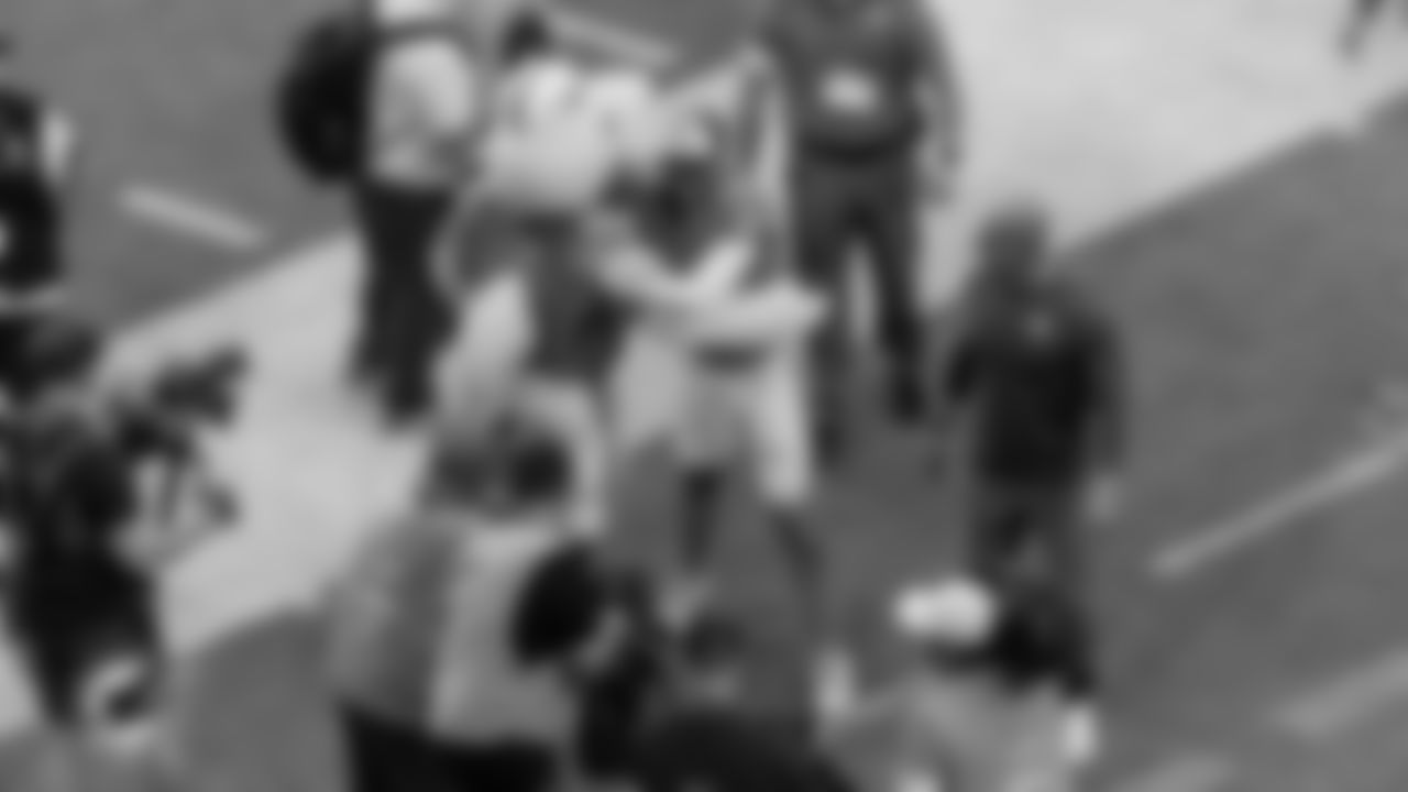 Miami Dolphins quarterback Quinn Ewers (14) hugs Mascot T.D. after an NFL football game against the Tampa Bay Buccaneers on Sunday, Dec. 28, 2025 in Miami Gardens, FL. (Lauren Sopourn/Miami Dolphins via AP)