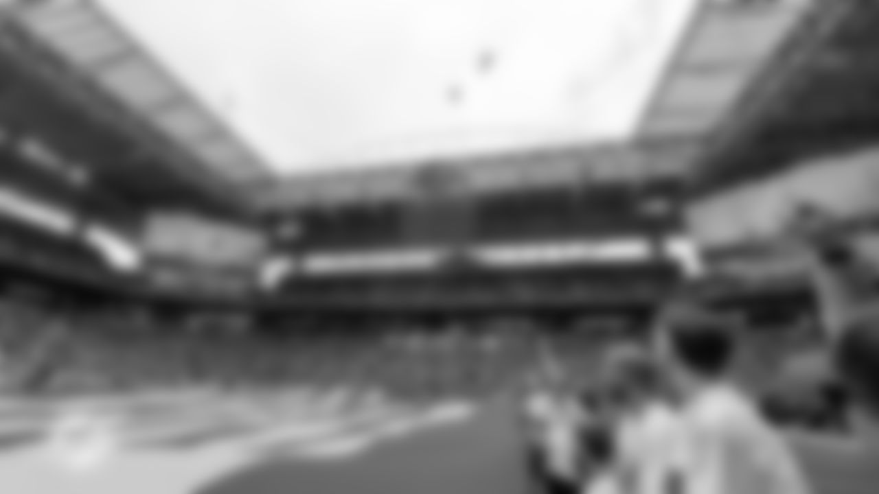 Miami Dolphins fans hold the American Flag for the National Anthem before an NFL football game against the New Orleans Saints on Sunday, Nov. 30, 2025 in Miami Gardens, FL. (Kevin Tubbergen/Miami Dolphins via AP)