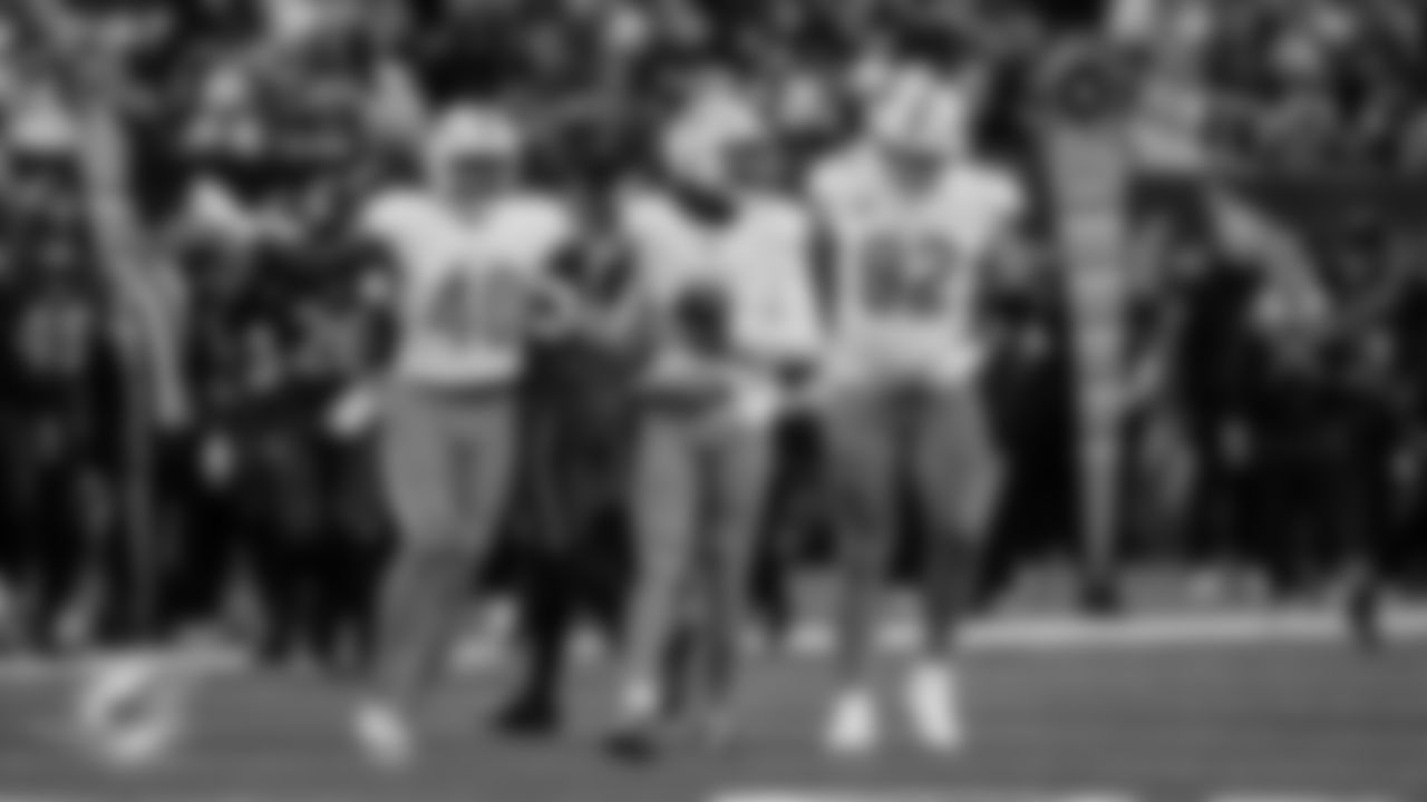 Miami Dolphins linebacker Jordyn Brooks (20), safety Ifeatu Melifonwu (9) and defensive tackle Zach Sieler (92) celebrate during an NFL football game against the New York Jets on Sunday, Dec. 7, 2025 in East Rutherford, NJ. (Tomas Diniz Santos/Miami Dolphins via AP)