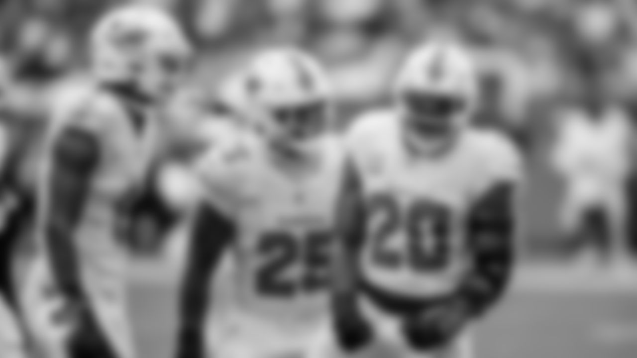 Miami Dolphins safety Ifeatu Melifonwu (9) and linebackers Tyrel Dodson (25) and Jordyn Brooks (20) celebrate during an NFL football game against the Buffalo Bills on Sunday, Nov. 9, 2025 in Miami Gardens, Fla. (Tomas Diniz Santos/Miami Dolphins via AP)