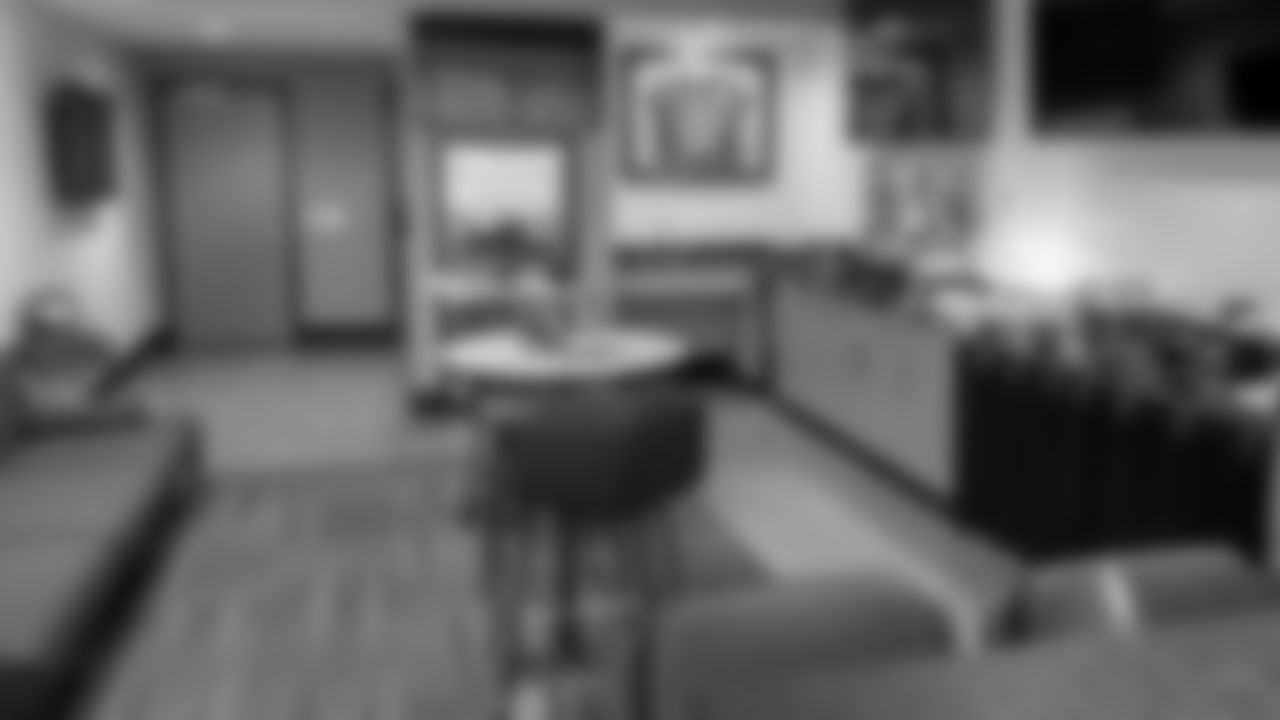 Hybrid Layout: One (1) three-person couch; Two (2) high top cocktail tables; Two (2) barstools per table.