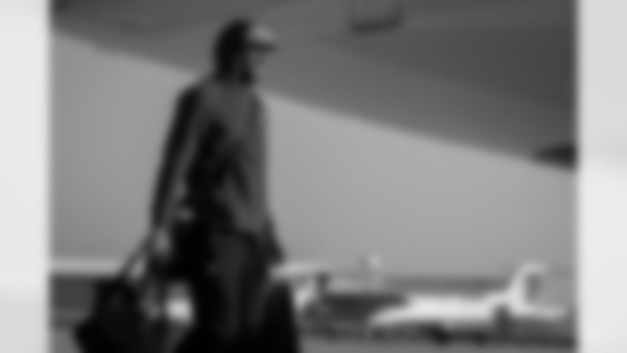 Atlanta Falcons tight end Feleipe Franks #84 boards the plane at Hartsfield-Jackson International Airport in Atlanta, Ga. on Saturday, November 6, 2025. (Photo by Taylor McLaughlin/Atlanta Falcons)