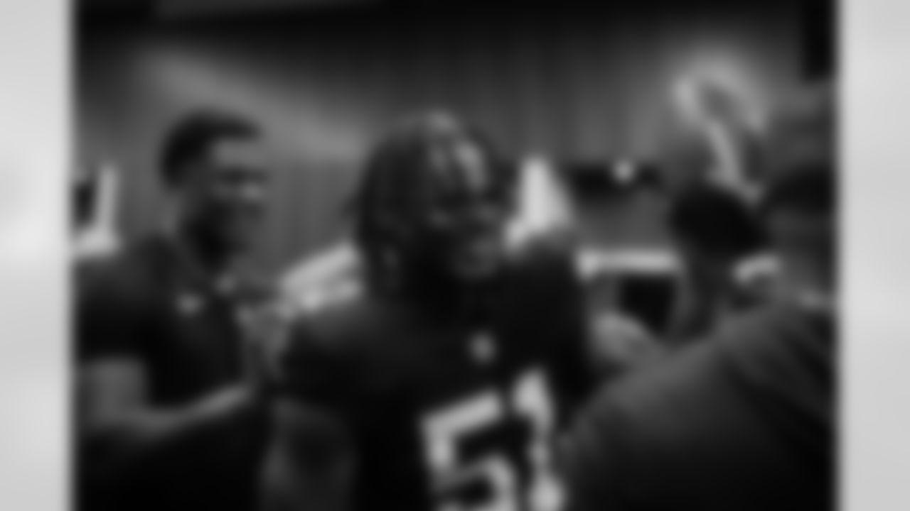Atlanta Falcons head coach Raheem Morris and Atlanta Falcons inside linebacker DeAngelo Malone #51 in the locker room after the Week 6 Game against the Buffalo Bills at Mercedes-Benz Stadium in Atlanta, Georgia on Monday, October 13, 2025. (Photo by Jay Bendlin/Atlanta Falcons)