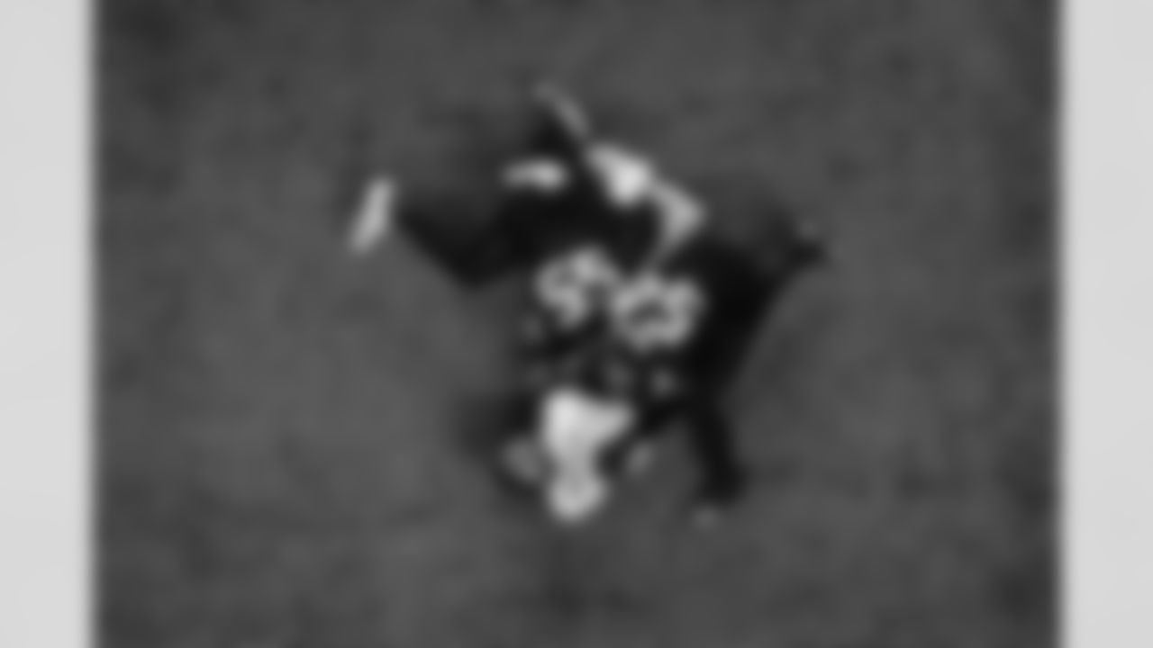 Atlanta Falcons inside linebacker Kaden Elliss #55 and Atlanta Falcons defensive tackle Brandon Dorlus #54  make a tackle during the Week 1 Game against the Tampa Bay Buccaneers at Mercedes-Benz Stadium in Atlanta, Georgia on Sunday, September 7, 2025. (Photo by Brandon Magnus/Atlanta Falcons)