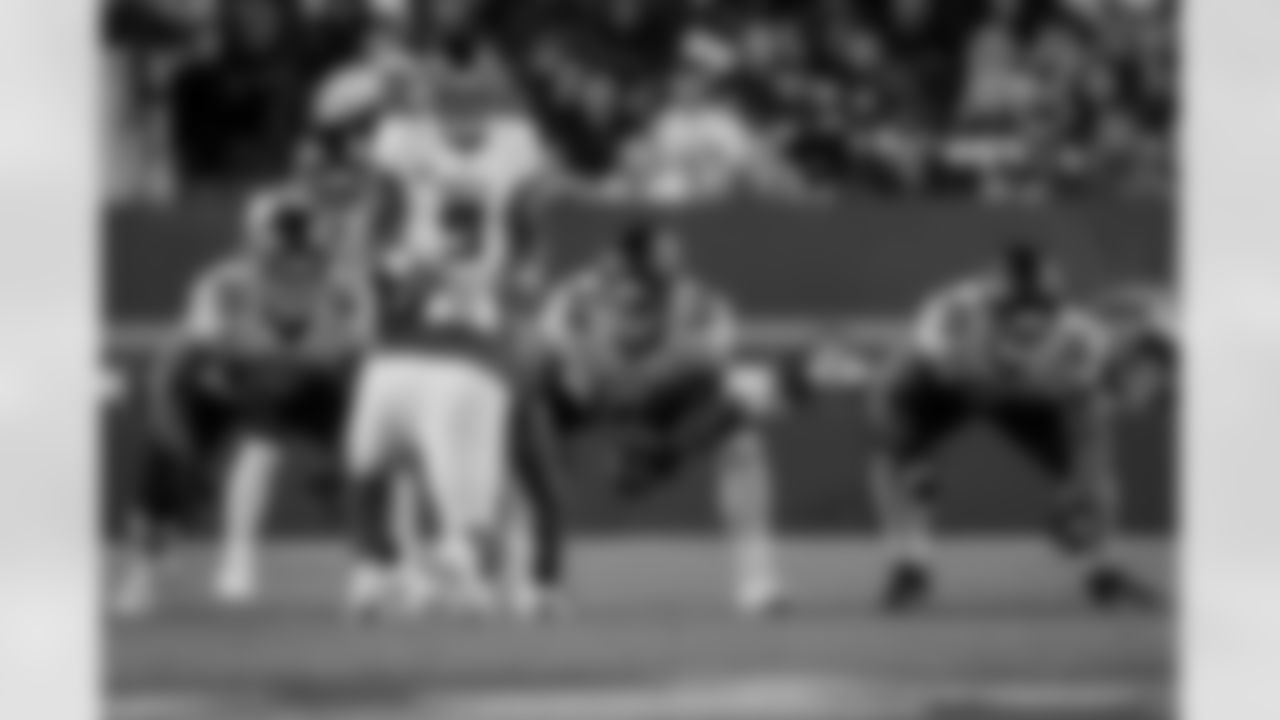 Atlanta Falcons offensive lineman Ryan Neuzil #64 snaps the ball to Atlanta Falcons quarterback Michael Penix Jr. #9 during the Week 7 Game against the San Francisco 49ers at Levi's Stadium in Santa Clara, California on Sunday, October 19, 2025. (Photo by Jay Bendlin/Atlanta Falcons)