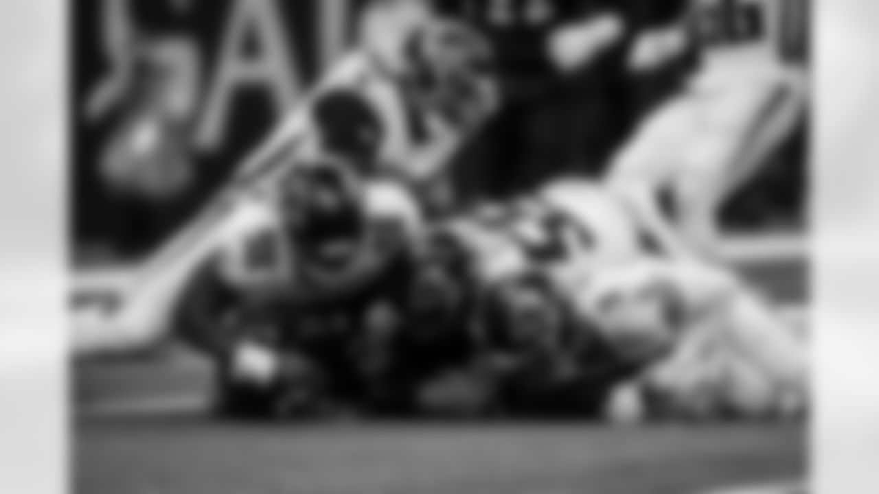 Atlanta Falcons defensive lineman Ruke Orhorhoro #98 , Atlanta Falcons inside linebacker Kaden Elliss #55 , Atlanta Falcons safety Jessie Bates III #3 make a tackle during the Week 12 Game against the New Orleans Saints at Caesars Superdome in New Orleans, Louisiana on Sunday, November 23, 2025. (Photo by Taylor McLaughlin/Atlanta Falcons)