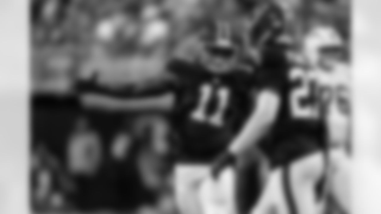 Atlanta Falcons edge rusher James Pearce Jr. #27 and Atlanta Falcons edge rusher Jalon Walker #11 celebrate a sack during the Week 6 Game against the Buffalo Bills at Mercedes-Benz Stadium in Atlanta, Ga. on Monday, October 13, 2025. (Photo by Taylor McLaughlin/Atlanta Falcons)