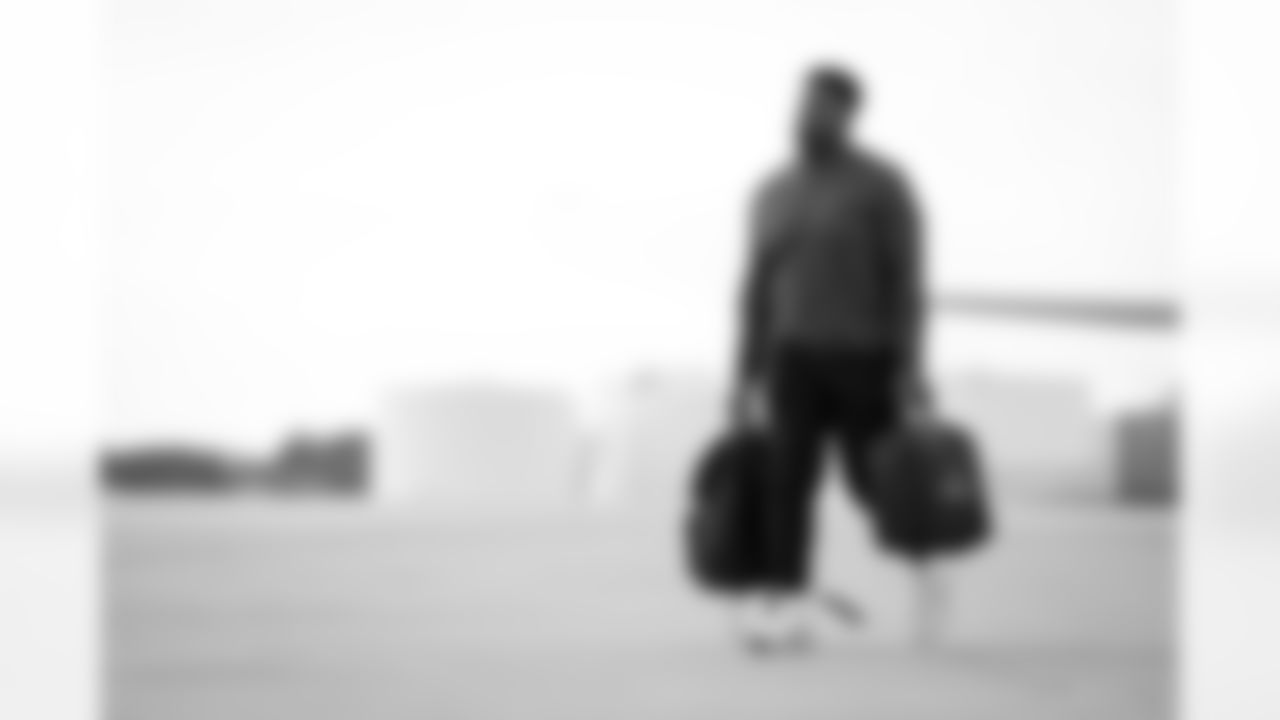 Atlanta Falcons defensive lineman Kentavius Street #93 boards the plane at Hartsfield-Jackson International Airport in Atlanta, Ga. on Taylor McLaughlin/Atlanta Falcons)