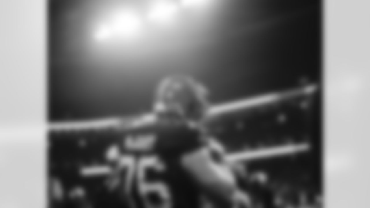 Atlanta Falcons tackle Kaleb McGary #76 puts on his helmet during the Week 5 Game against the Tampa Bay Buccaneers at Mercedes-Benz Stadium in Atlanta, Georgia on Thursday, October 3, 2024. (Photo by Brandon Magnus/Atlanta Falcons)