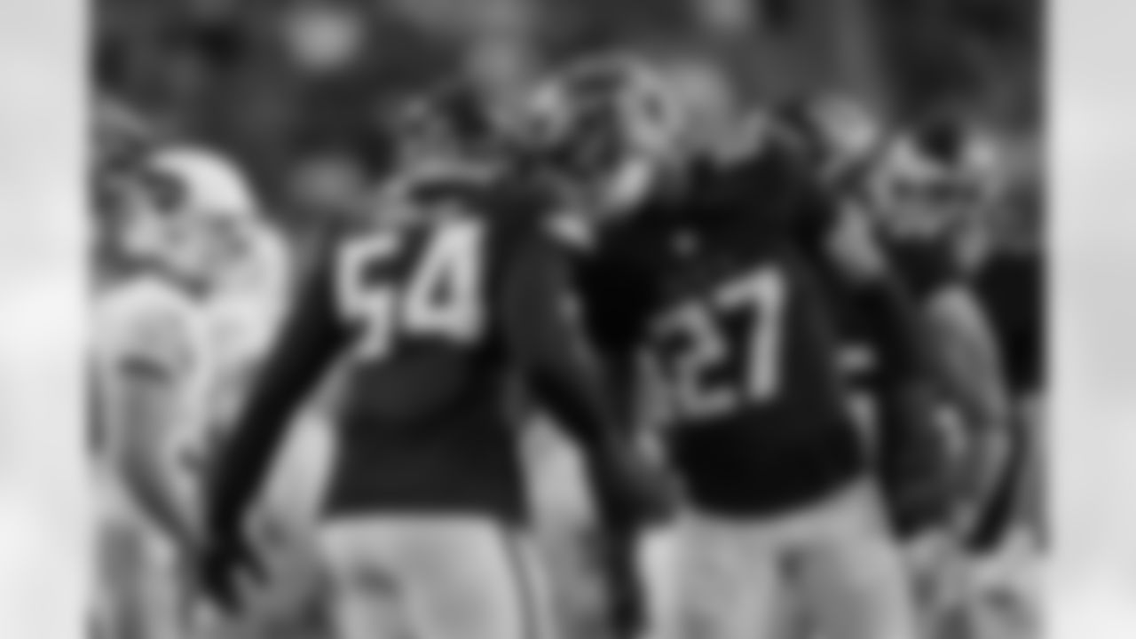 Atlanta Falcons defensive tackle Brandon Dorlus #54 celebrates with Atlanta Falcons edge rusher James Pearce Jr. #27 after making a sack during the Week 16 Game against the Arizona Cardinals at State Farm Stadium in Glendale, Arizona on Sunday, December 21, 2025. (Photo by Taylor McLaughlin/Atlanta Falcons)