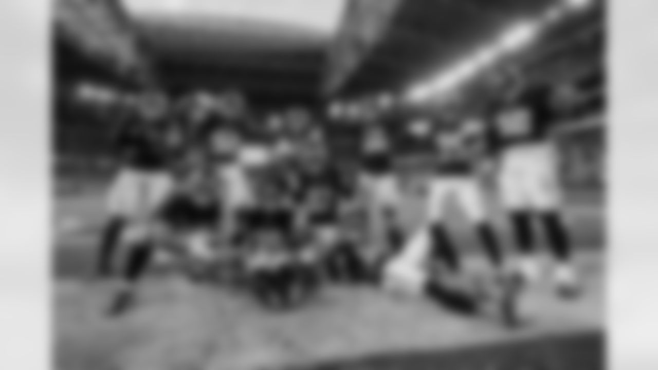 Atlanta Falcons defensive players pose for a photo after Atlanta Falcons cornerback CJ Henderson #39 makes an interception during the Week 16 Game against the Arizona Cardinals at State Farm Stadium in Glendale, Arizona on Sunday, December 21, 2025. (Photo by Taylor McLaughlin/Atlanta Falcons)