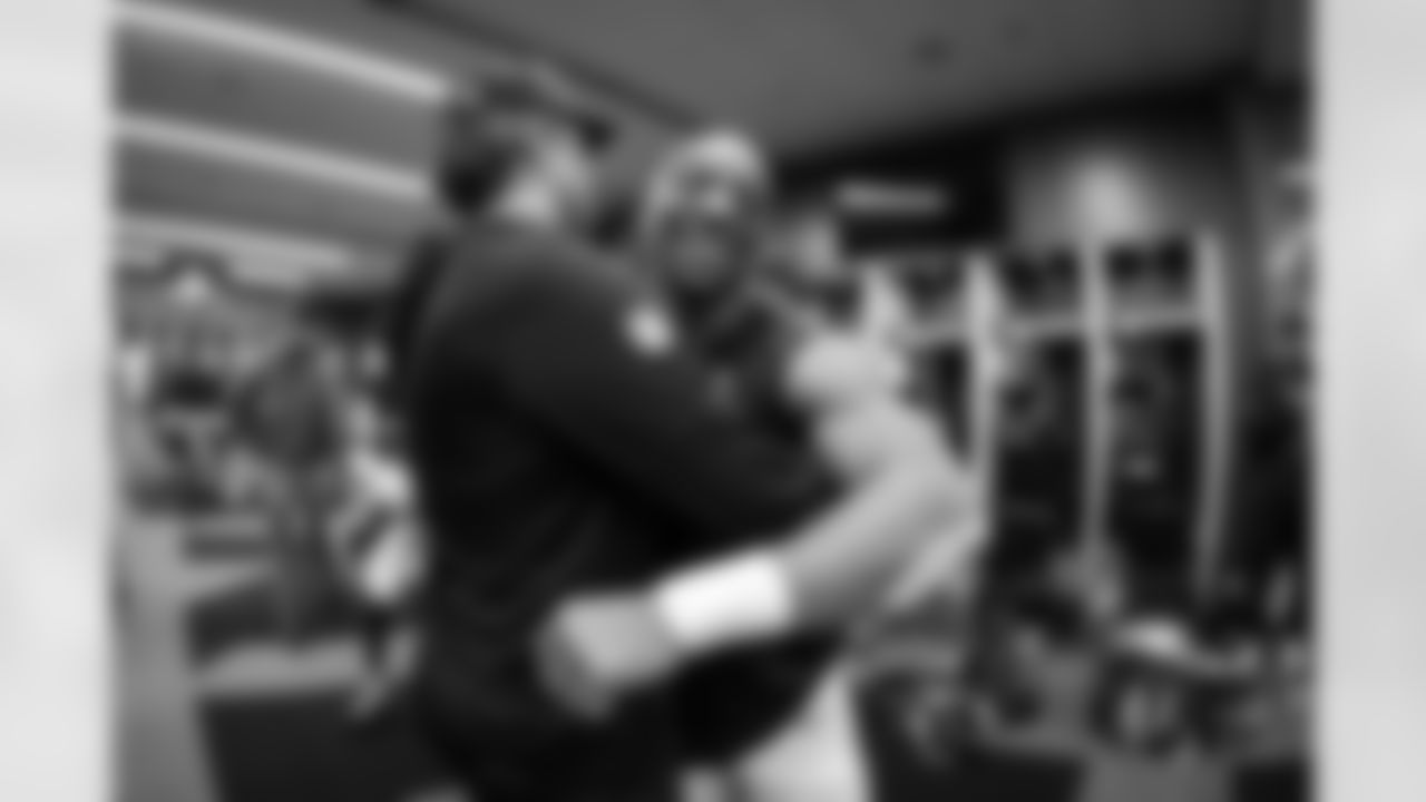 Atlanta Falcons running back Bijan Robinson #7 and Atlanta Falcons offensive coordinator Zac Robinson in the locker room after the Week 17 Game against the Los Angeles Rams at Mercedes-Benz Stadium in Atlanta, Georgia on Monday, December 29, 2025. (Photo by Jay Bendlin/Atlanta Falcons)