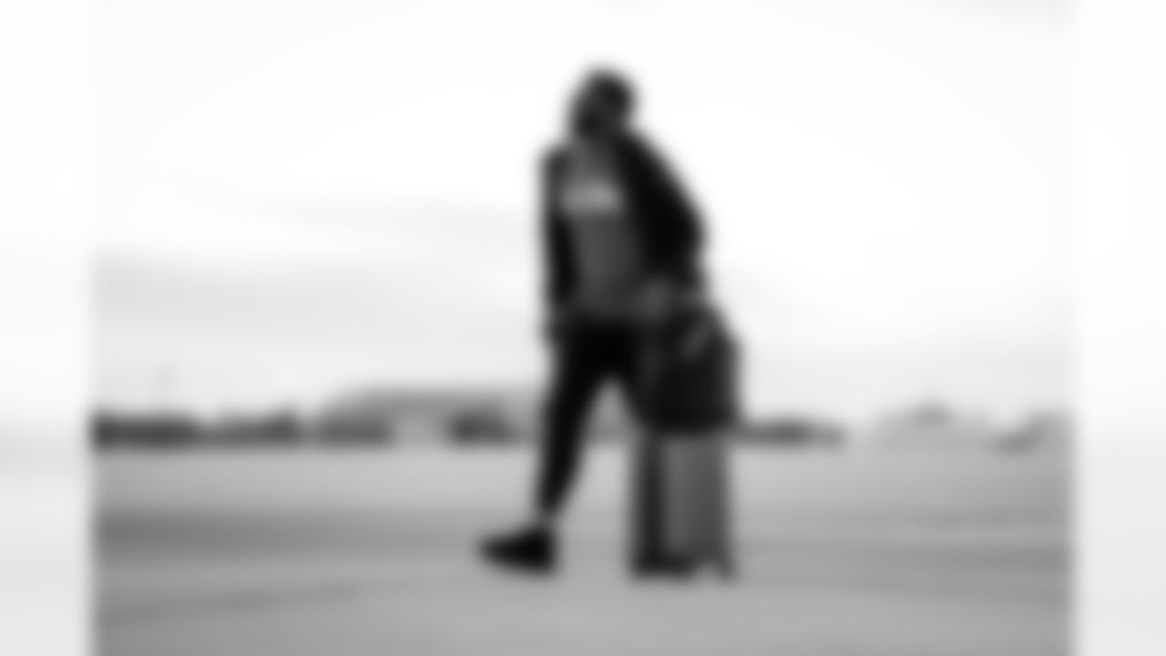 Atlanta Falcons outside linebacker Divine Deablo #0 boards the plane at Hartsfield-Jackson International Airport in Atlanta, Ga. on Taylor McLaughlin/Atlanta Falcons)