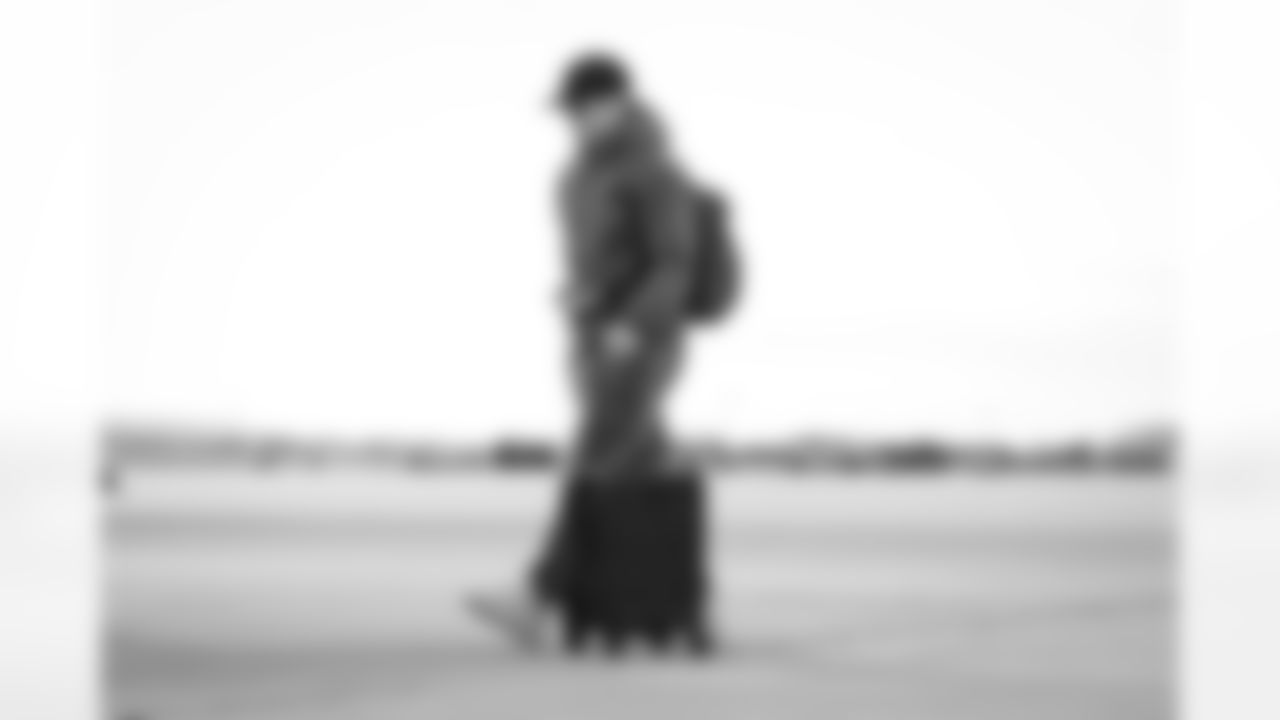 Atlanta Falcons inside linebacker JD Bertrand #40 boards the plane at Hartsfield-Jackson International Airport in Atlanta, Ga. on Taylor McLaughlin/Atlanta Falcons)