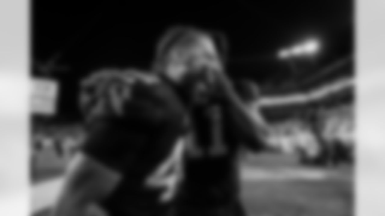 Atlanta Falcons linebacker Josh Woods #42 and Atlanta Falcons edge rusher Jalon Walker #11 celebrate during the Week 15 Game against the Tampa Bay Buccaneers at Raymond James Stadium in Tampa, Florida on Thursday, December 11, 2025. (Photo by Taylor McLaughlin/Atlanta Falcons)