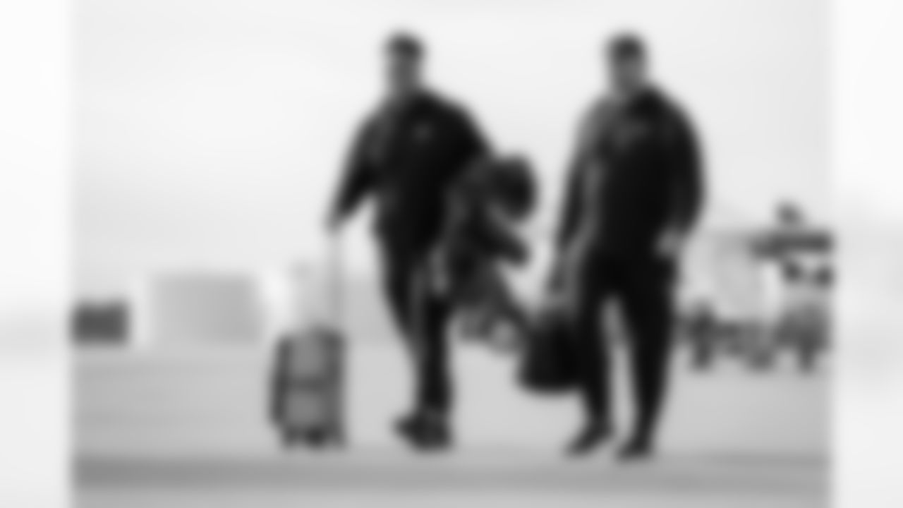 Atlanta Falcons offensive lineman Matthew Bergeron #65 boards the plane at Hartsfield-Jackson International Airport in Atlanta, Ga. on Taylor McLaughlin/Atlanta Falcons)