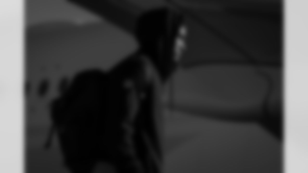 Atlanta Falcons safety Xavier Watts #31 boards the plane at Hartsfield-Jackson International Airport in Atlanta, Ga. on Saturday, December 20, 2025. (Photo by Jay Bendlin/Atlanta Falcons)