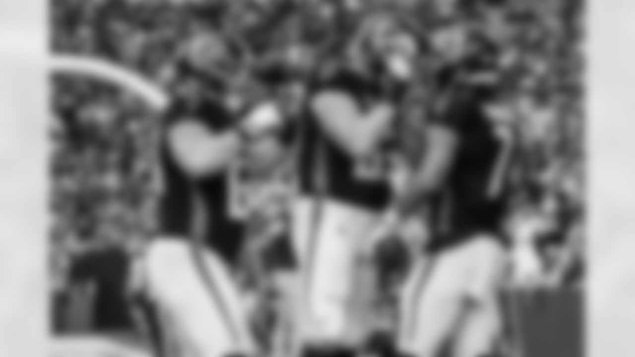 Atlanta Falcons guard Chris Lindstrom #63 and Atlanta Falcons offensive lineman Ryan Neuzil #64 celebrate with Atlanta Falcons running back Bijan Robinson #7 after his touchdown during the Week 16 Game against the Arizona Cardinals at State Farm Stadium in Glendale, Arizona on Sunday, December 21, 2025. (Photo by Taylor McLaughlin/Atlanta Falcons)