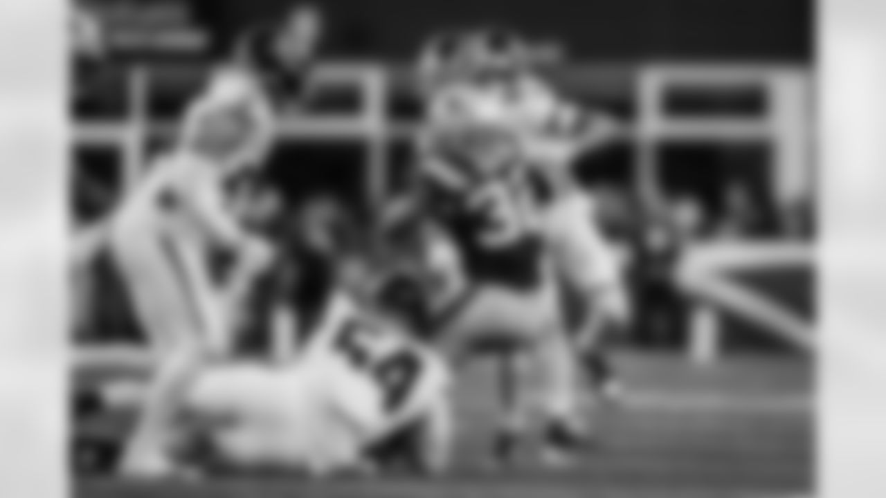 Atlanta Falcons defensive tackle Brandon Dorlus #54 and cornerback A.J. Terrell #24 make a tackle during the fourth quarter of the Week 9 Game against the New England Patriots at Gillette Stadium in Foxborough, Massachusetts on Sunday, November 2, 2025. (Photo by Taylor McLaughlin/Atlanta Falcons)