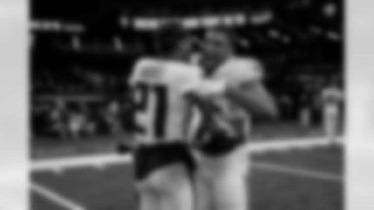 Atlanta Falcons cornerback Mike Hughes #21 and Atlanta Falcons safety Xavier Watts #31 celebrate after the Week 12 Game against the New Orleans Saints at Caesars Superdome in New Orleans, Louisiana on Sunday, November 23, 2025. (Photo by Jay Bendlin/Atlanta Falcons)