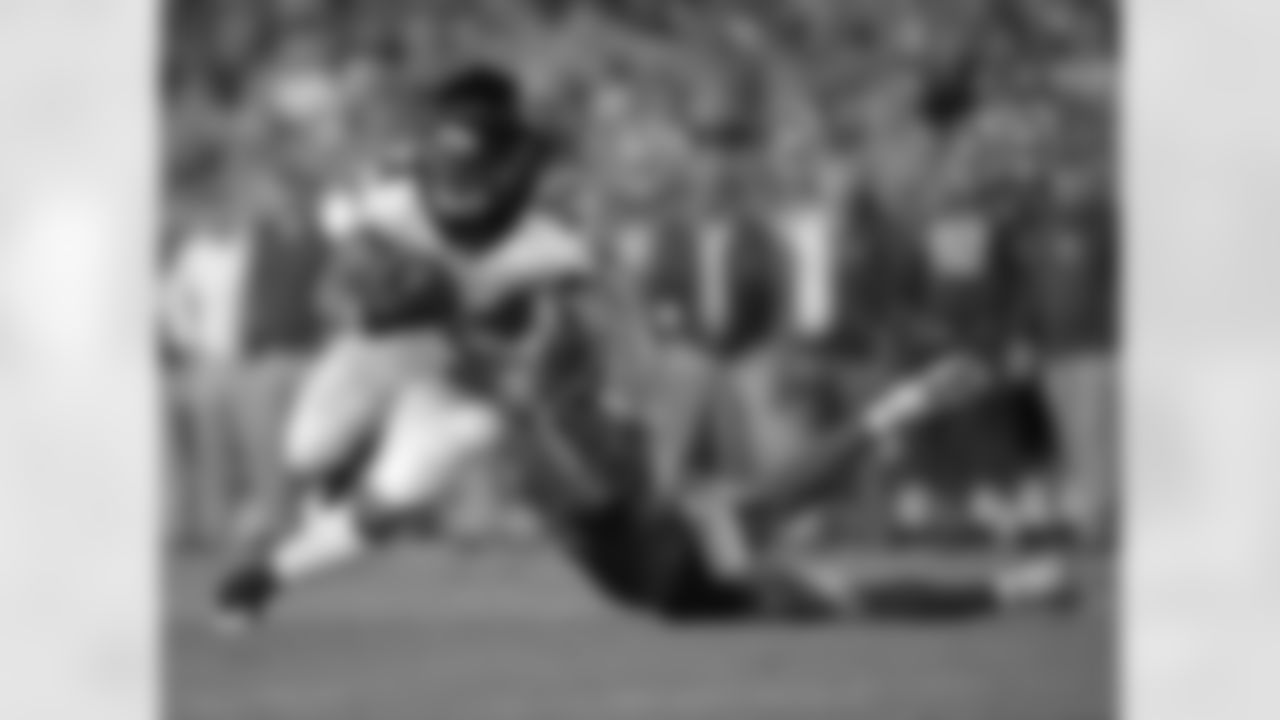 Atlanta Falcons running back Devonta Freeman (24) looks to get around Tampa Bay Buccaneers free safety Chris Conte, right, after a reception during the first half of an NFL football game, Monday, Dec. 18, 2017, in Tampa, Fla. (AP Photo/Phelan M. Ebenhack)