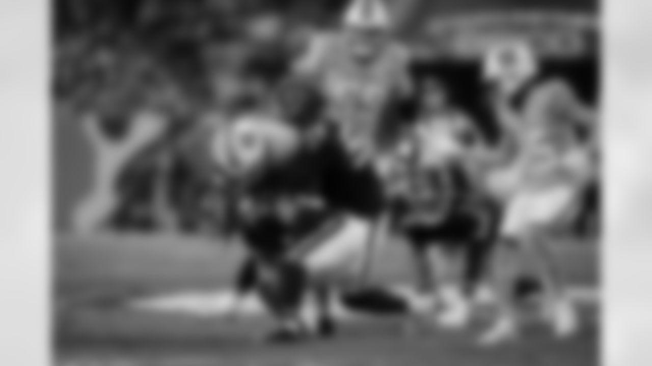 Atlanta Falcons defensive tackle Brandon Dorlus #54 and Atlanta Falcons cornerback A.J. Terrell #24 make a tackle during the Week 15 Game against the Tampa Bay Buccaneers at Raymond James Stadium in Tampa, Florida on Thursday, December 11, 2025. (Photo by Taylor McLaughlin/Atlanta Falcons)