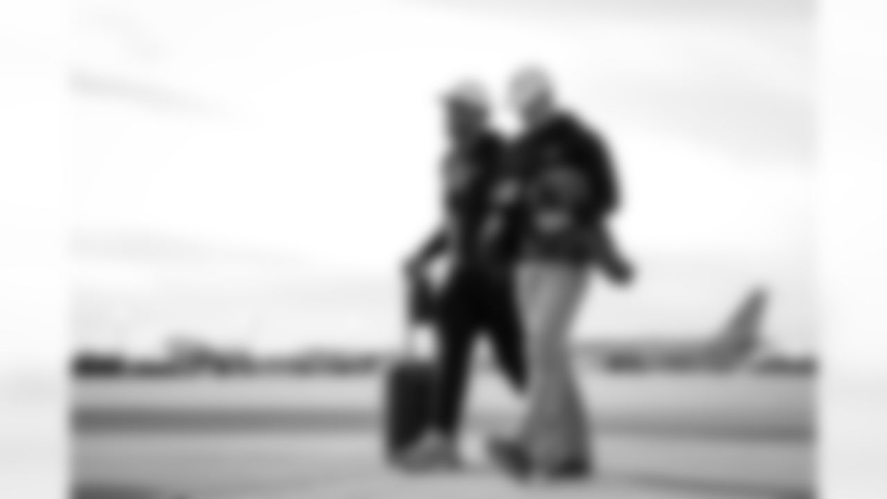 Atlanta Falcons tight end Charlie Woerner #89 and Atlanta Falcons offensive lineman Elijah Wilkinson #71 board the plane at Hartsfield-Jackson International Airport in Atlanta, Ga. on Taylor McLaughlin/Atlanta Falcons)