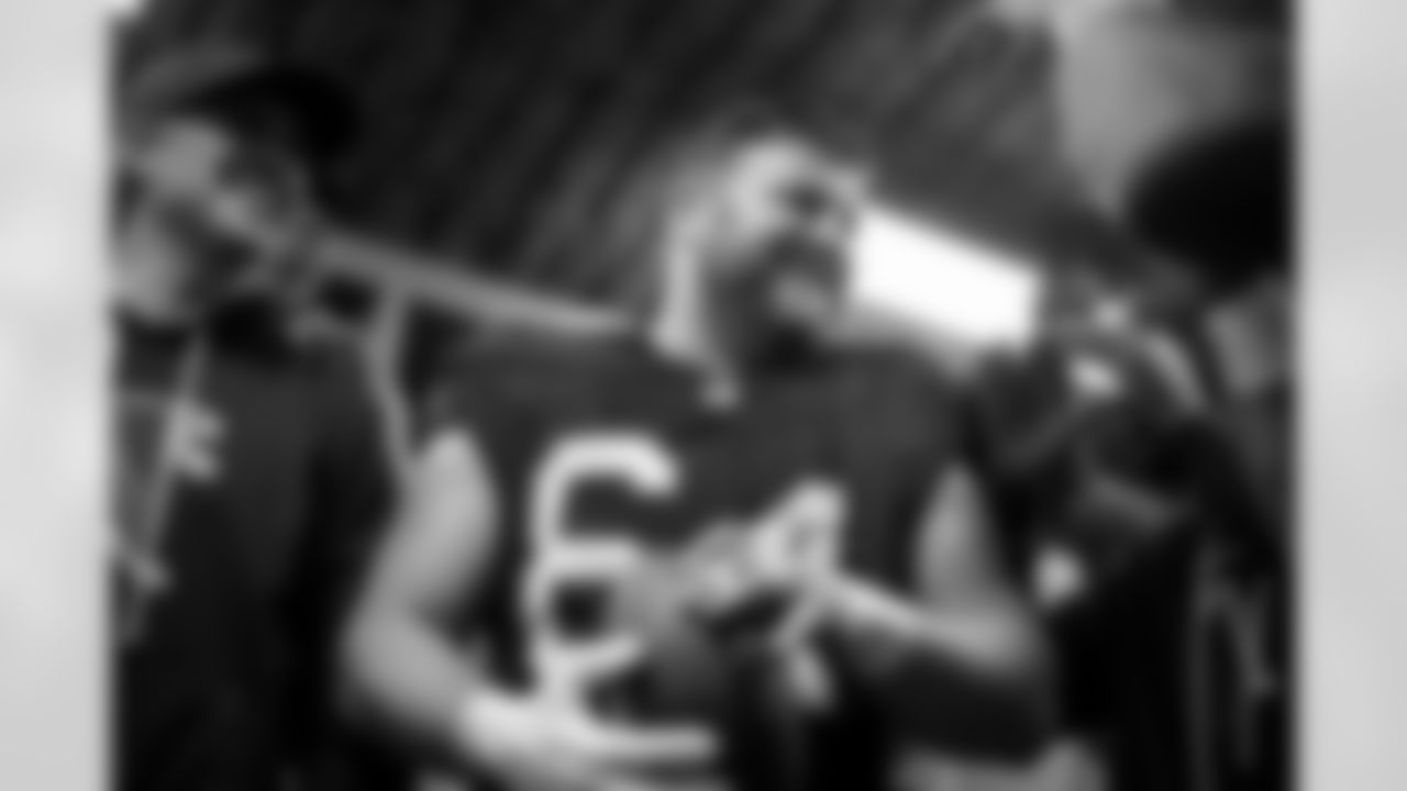 Atlanta Falcons offensive lineman Ryan Neuzil #64 celebrates in the locker room during the Week 15 Game against the Tampa Bay Buccaneers at Raymond James Stadium in Tampa, Florida on Thursday, December 11, 2025. (Photo by Jay Bendlin/Atlanta Falcons)