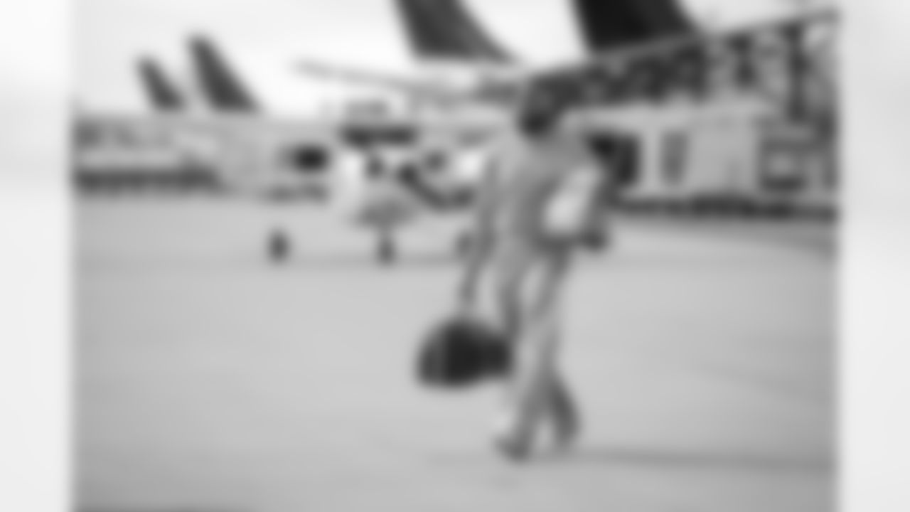 Atlanta Falcons linebacker Josh Woods #42 boards the plane at Hartsfield-Jackson International Airport in Atlanta, Ga. on Taylor McLaughlin/Atlanta Falcons)