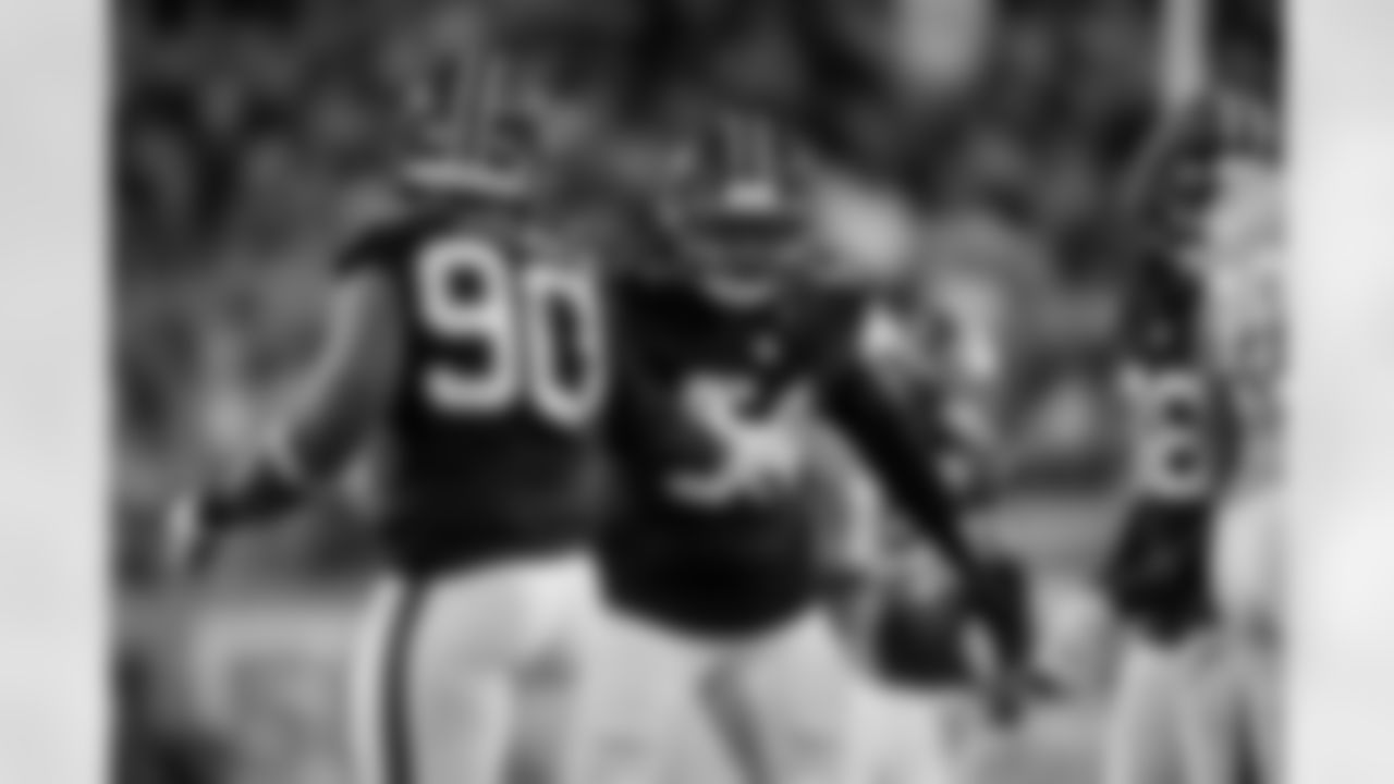 Atlanta Falcons defensive lineman David Onyemata #90 reacts with Atlanta Falcons defensive tackle Brandon Dorlus #54 during the Week 15 Game against the Tampa Bay Buccaneers at Raymond James Stadium in Tampa, Florida on Thursday, December 11, 2025. (Photo by Jay Bendlin/Atlanta Falcons)