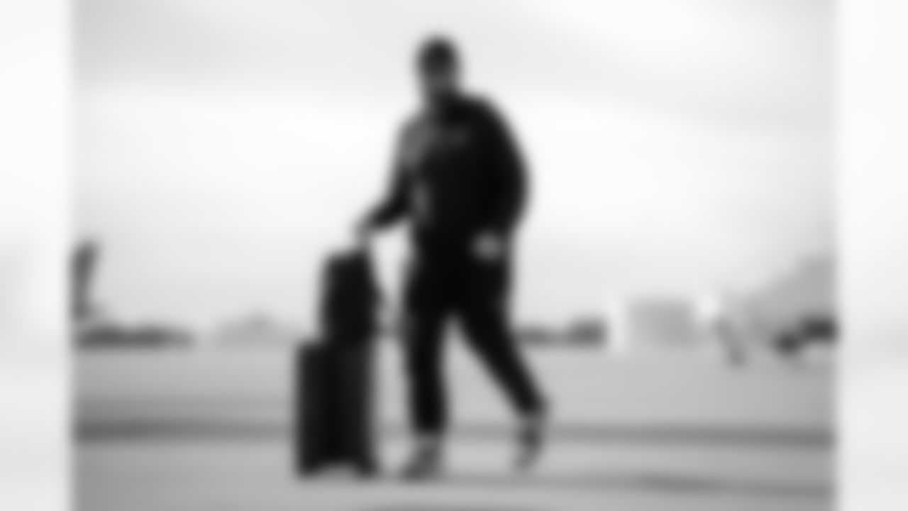 Atlanta Falcons long snapper Liam McCullough #49 boards the plane at Hartsfield-Jackson International Airport in Atlanta, Ga. on Taylor McLaughlin/Atlanta Falcons)