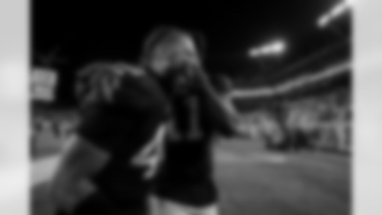 Atlanta Falcons linebacker Josh Woods #42 and Atlanta Falcons edge rusher Jalon Walker #11 celebrate during the Week 15 Game against the Tampa Bay Buccaneers at Raymond James Stadium in Tampa, Florida on Thursday, December 11, 2025. (Photo by Taylor McLaughlin/Atlanta Falcons)