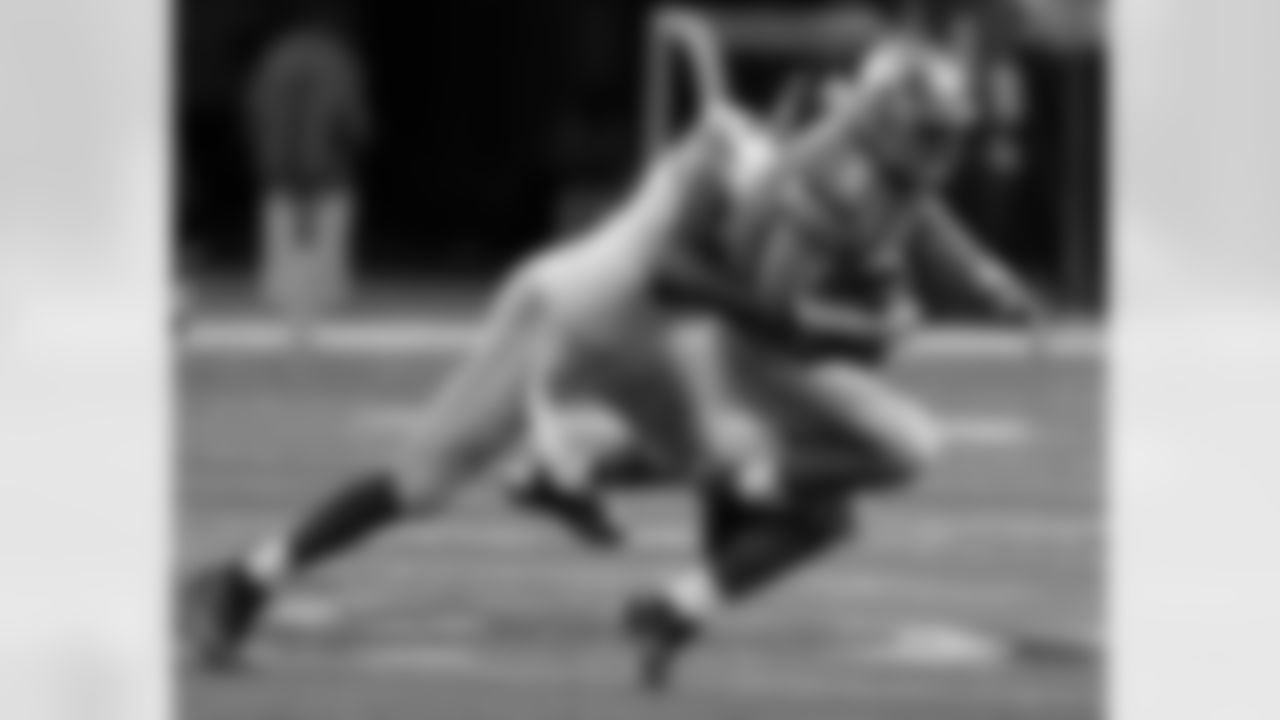 Detroit Lions quarterback Matthew Stafford (9) is sacked by New York Giants defensive end Mathias Kiwanuka during the first quarter of an NFL football game in Detroit, Sunday, Dec. 22, 2013. (AP Photo/Duane Burleson)