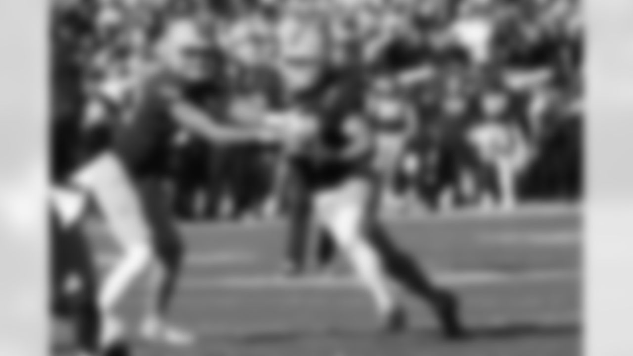Arizona State quarterback Sam Leavitt, left, hands the ball off to Arizona State running back Cam Skattebo during the first half of an NCAA college football game against BYU Saturday, Nov. 23, 2024, in Tempe, Ariz. (AP Photo/Ross D. Franklin)