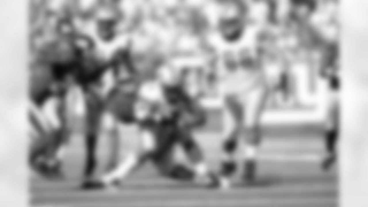 Detroit Lions running back Kevin Smith (34) is tackled by New York Giants defensive tackle Barry Cofield (96) during the second quarter of an NFL football game between the Detroit Lions and the New York Giants at New Meadowlands Stadium Sunday, Oct. 17, 2010, in East Rutherford, N.J. (AP Photo/Tim Larsen)