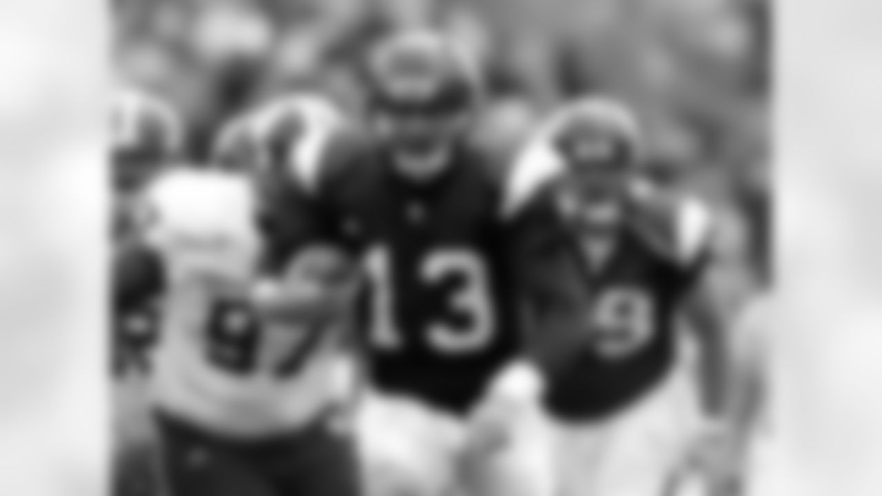 Northwestern's Mike Kafka (13) runs upfield against Indiana during the first half of an NCAA college football game Saturday, Oct. 24, 2009, in Evanston, Ill. (AP Photo/Jim Prisching)