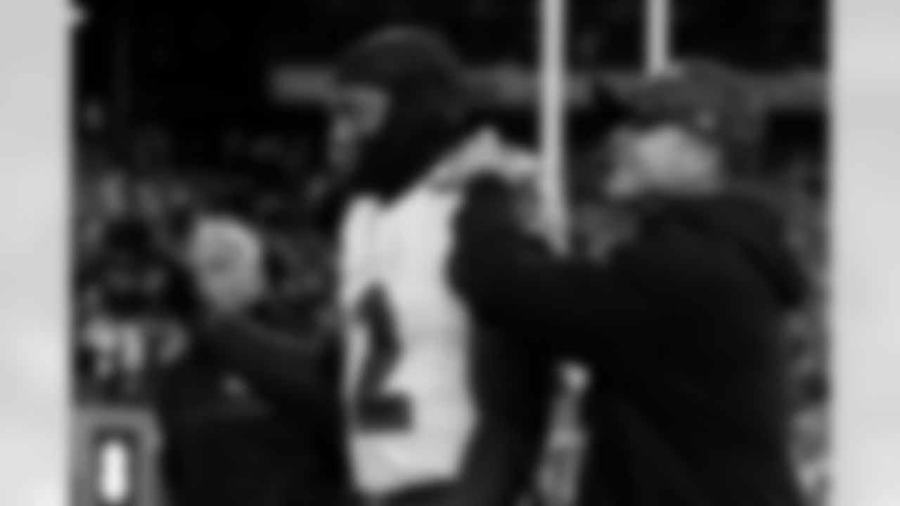 Baltimore Ravens running back Derrick Henry (22) reacts with head coach John Harbaugh reacts after an NFL football game against the New York Giants Sunday, Dec. 15, 2024, in East Rutherford, N.J. (AP Photo/Adam Hunger)