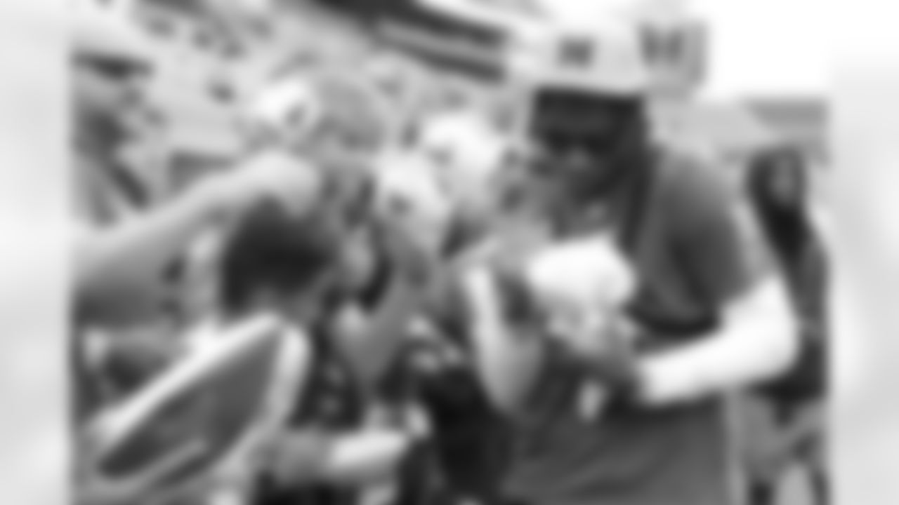 NFC wide receiver Malik Nabers (1) of the New York Giants signs autographs during a practice session prior to an NFL Pro Bowl football game, Saturday, Feb. 1, 2025, in Orlando, Fla. (Perry Knotts via AP)