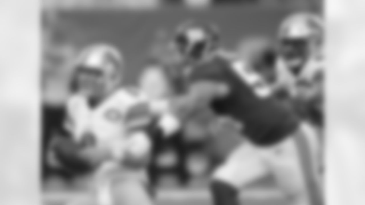 Detroit Lions quarterback Matthew Stafford (9) spins to avoid a sack by New York Giants' Olivier Vernon (54) during the first half of an NFL football game Sunday, Dec. 18, 2016, in East Rutherford, N.J. (AP Photo/Bill Kostroun)