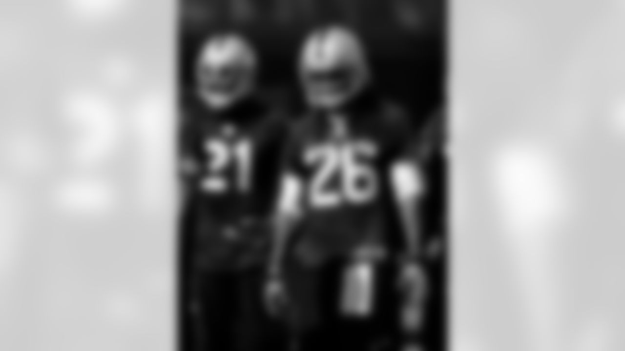 Oakland Raiders cornerback Mike Jenkins, left, and safety Usama Young, right, during their NFL football training camp Friday, July 26, 2013, in Napa, Calif. (AP Photo/Eric Risberg)