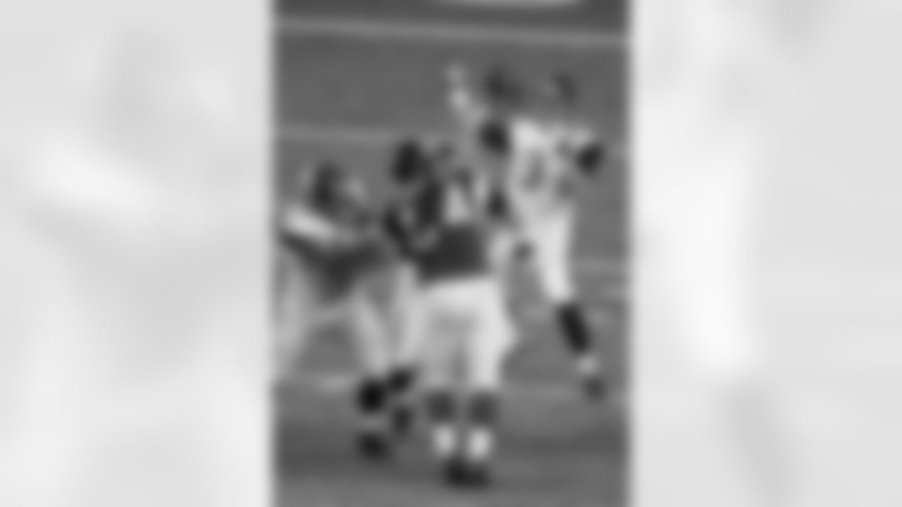 Jacksonville Jaguars quarterback Mike Kafka (3) works against the Atlanta Falcons during the second half of a preseason NFL football game, Thursday, Aug. 29, 2013, in Atlanta.(AP Photo/John Bazemore)