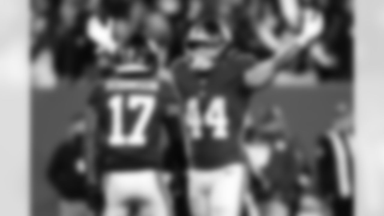 New York Giants running back Cam Skattebo (44) and wide receiver Wan'Dale Robinson (17) celebrate after a touchdown during an NFL football game against the Philadelphia Eagles, Thursday, Oct. 9, 2025 in East Rutherford, N.J. (Kevin Sabitus via AP)