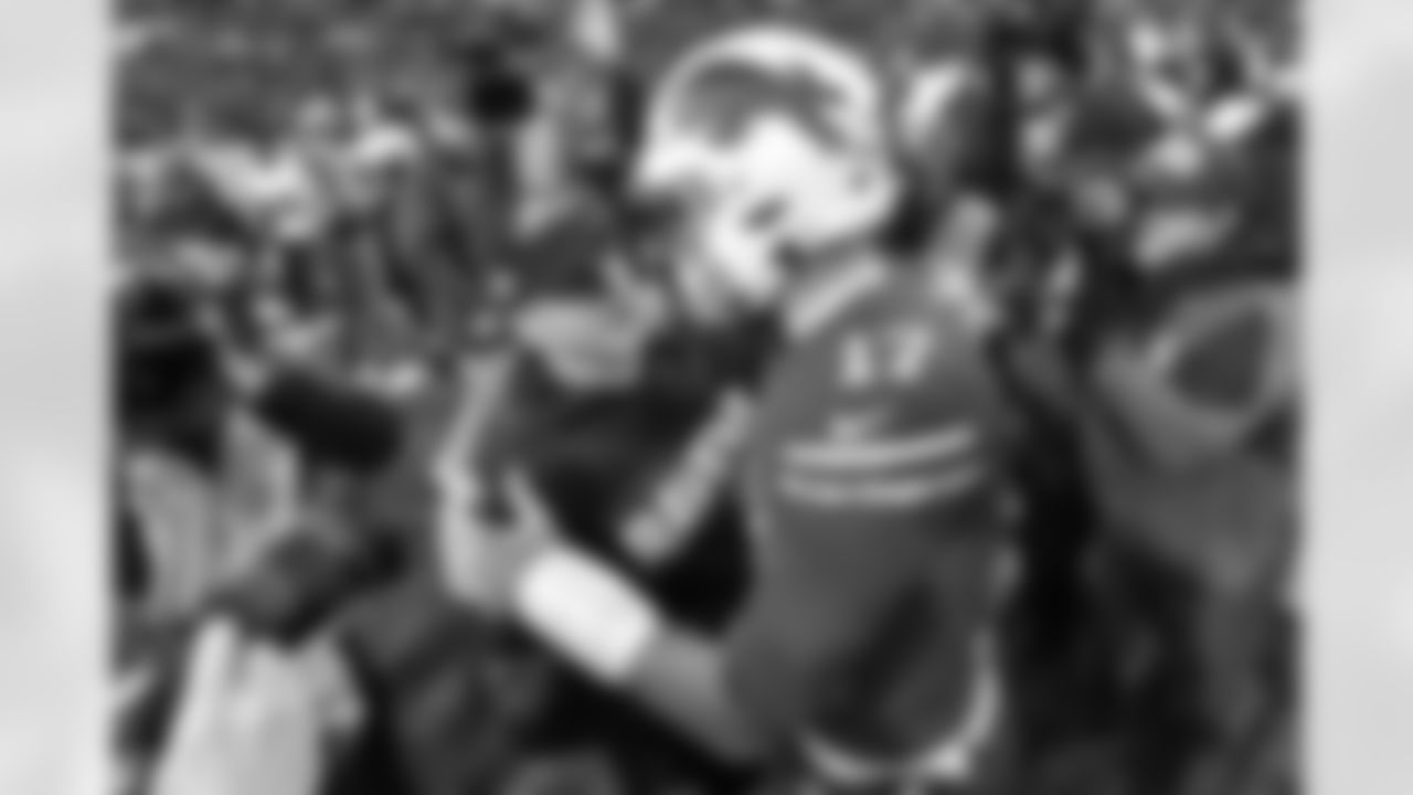 Baltimore Ravens head coach John Harbaugh, left center, talks with Buffalo Bills quarterback Josh Allen (17) following an NFL football game in Orchard Park, N.Y., Sunday, Dec. 8, 2019. The Ravens won 24-17. (AP Photo/Adrian Kraus)