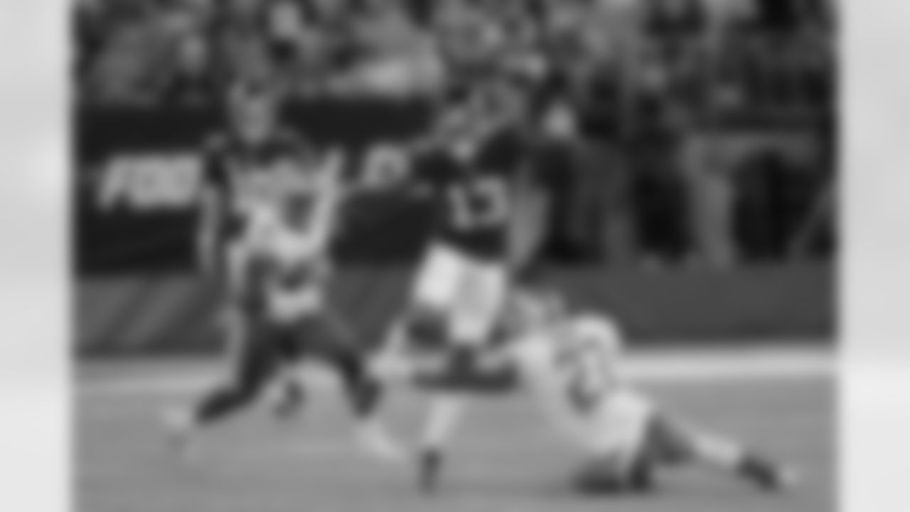 New York Giants wide receiver Odell Beckham (13) leaps over Detroit Lions' Glover Quin (27) as Jarrad Davis (40) watches during the first half of an NFL football game Monday, Sept. 18, 2017, in East Rutherford, N.J. (AP Photo/Bill Kostroun)