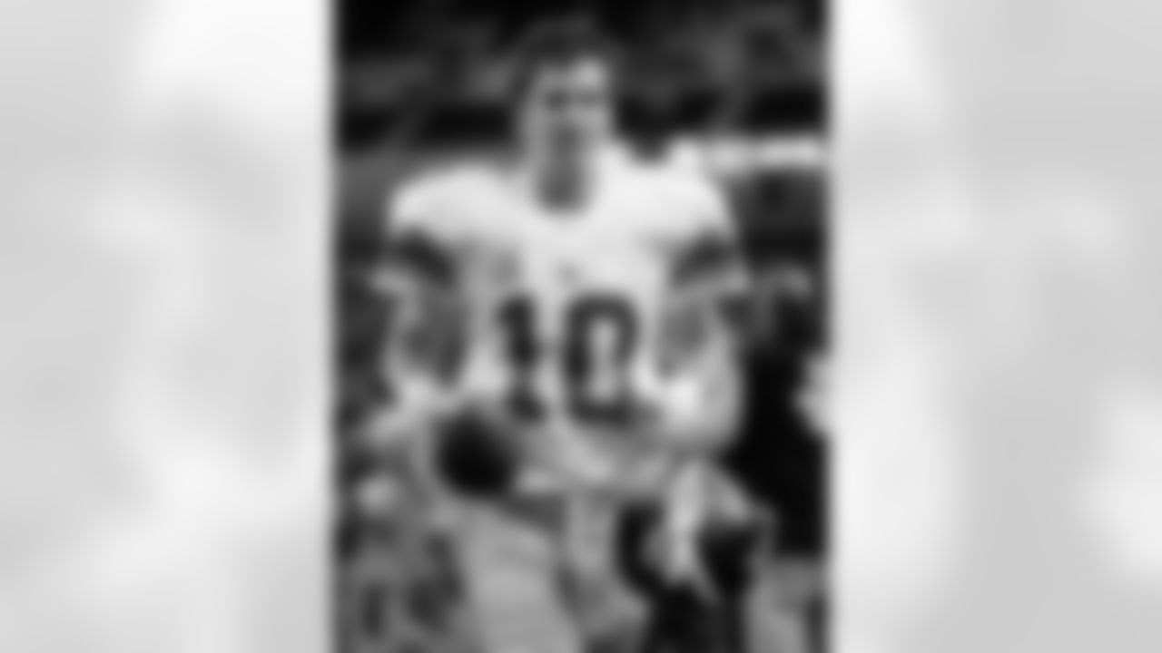 New York Giants quarterback Eli Manning runs off the field after beating the Detroit Lions 16-10 in an NFL football game in Detroit, Sunday, Nov. 18, 2007. (AP Photo/Paul Sancya)