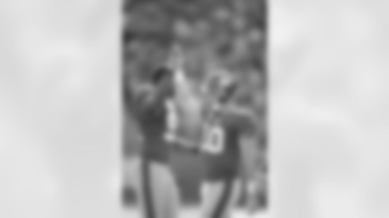 New York Giants quaterback Eli Manning (10) gives a high five after throwing a touchdown pass against the Detroit Lions in a week 6 NFL football game at the New Meadowlands Stadium in East Rutherford, New Jersey on Sunday October 17, 2010 (AP Photo/Evan Pinkus)