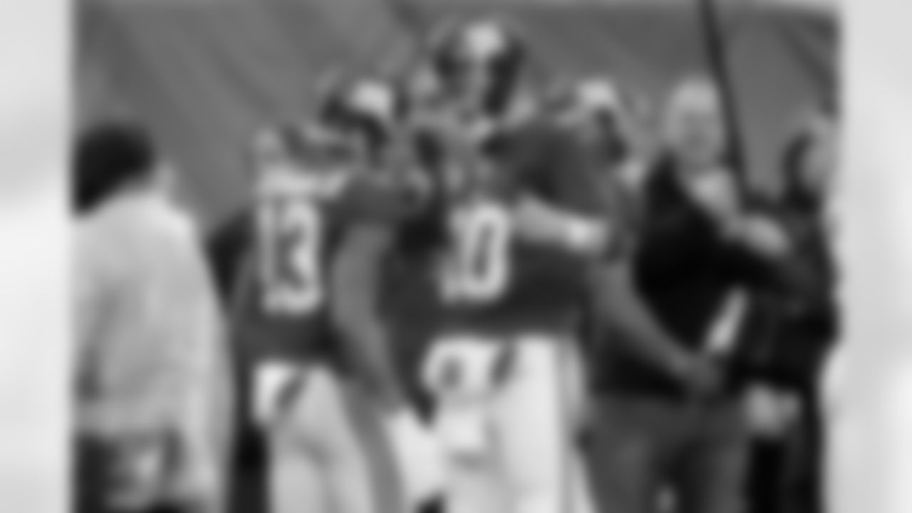 New York Giants quarterback Eli Manning, right, and Odell Beckham, left, celebrate after they connected for a touchdown during the second half of an NFL football game against the Detroit Lions Sunday, Dec. 18, 2016, in East Rutherford, N.J. (AP Photo/Seth Wenig)